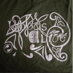 The Roots Alive logo in white on a dark green background. The logo says Roots Alive and is surrounded by celtic knot-style artwork.