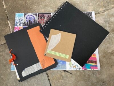 pile of sketchbooks
