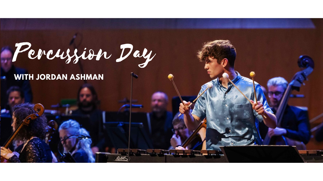 Jordan Ashman playing a xylophone with an orchestra behind