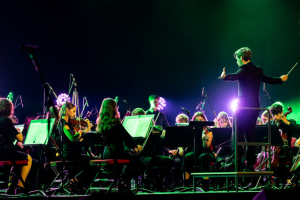 City of Leeds Youth Orchestra playing on the Leeds arena stage. 
