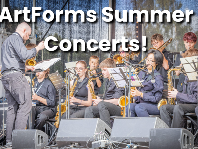 Leeds Youth Jazz Rock Orchestra playing on stage, playing saxophones and brass instruments. ArtForms Summer Concerts is in text over at the top.