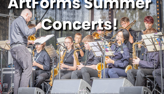 Leeds Youth Jazz Rock Orchestra playing on stage, playing saxophones and brass instruments. ArtForms Summer Concerts is in text over at the top.